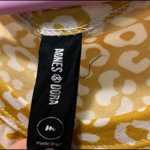 Agnes and Dora relaxed ruffle tank mustard animal.